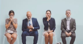 Adults experiencing illness and discomfort while waiting for care, representing primary care access shortages and unmet healthcare needs.